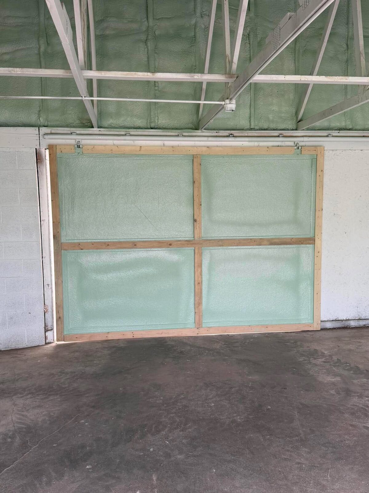 Coated garage floor with overhead door