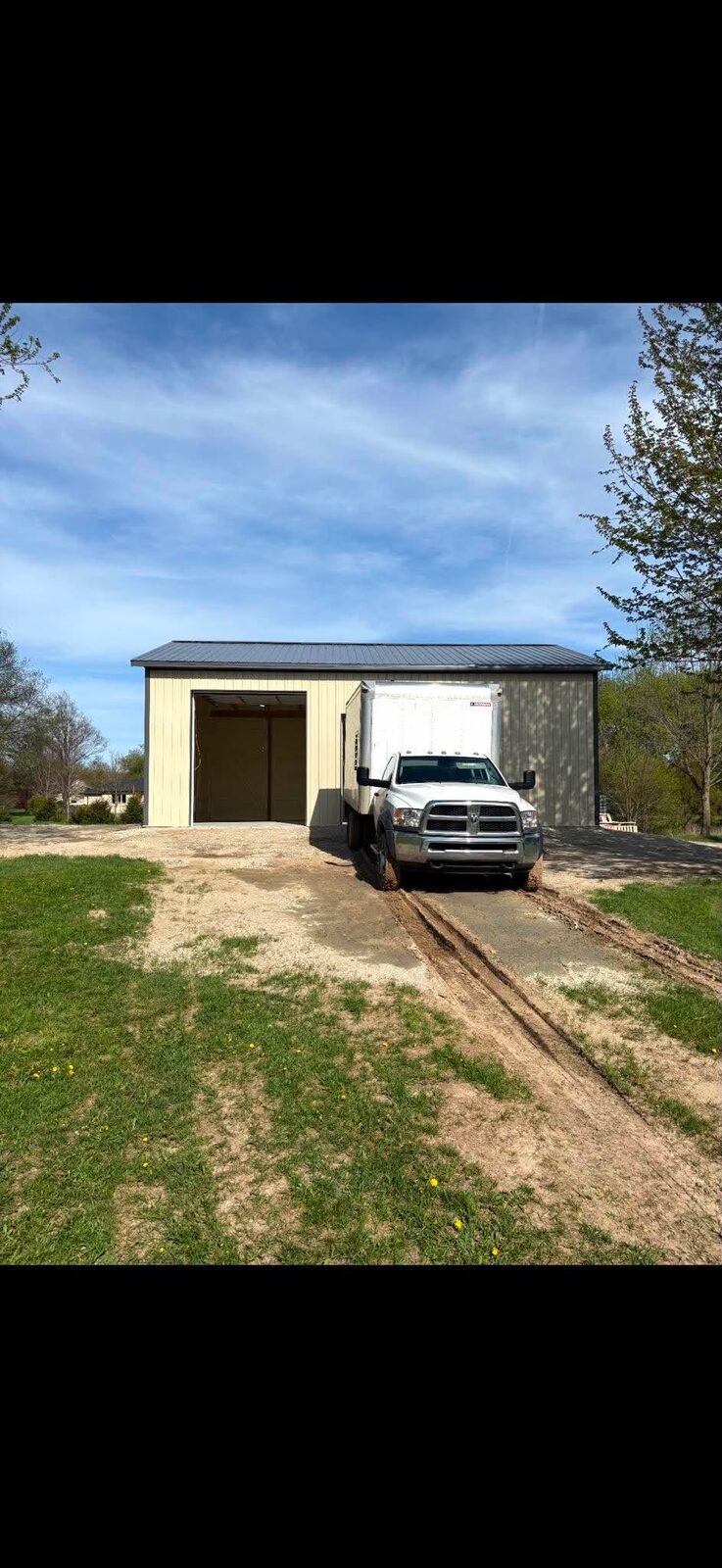 Finished pole barn with work truck