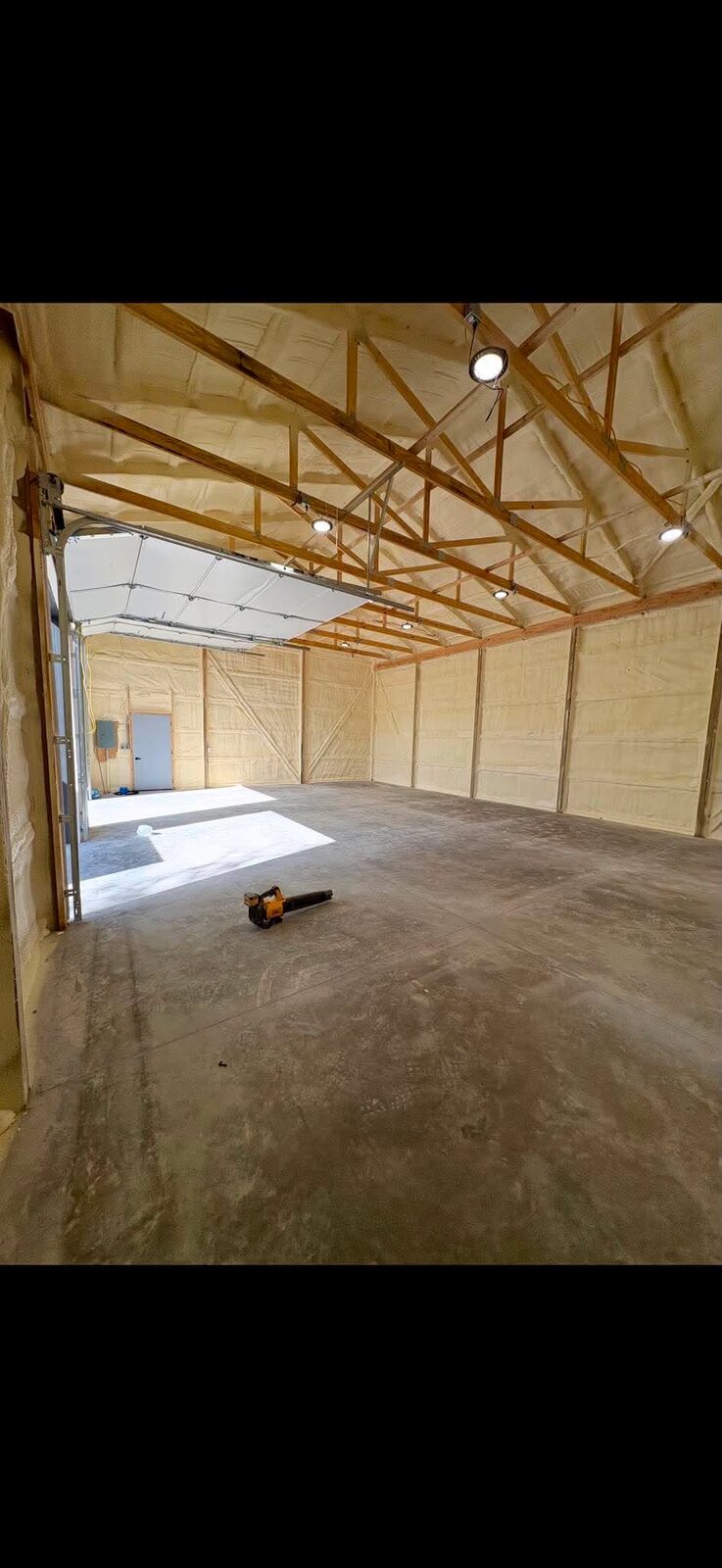 Spray foam insulated pole barn interior by MotorCity Polymers